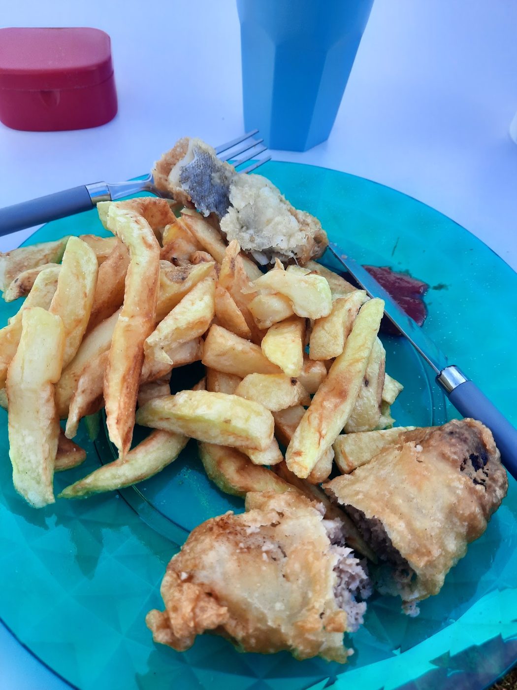Fish and chips on a blue plate